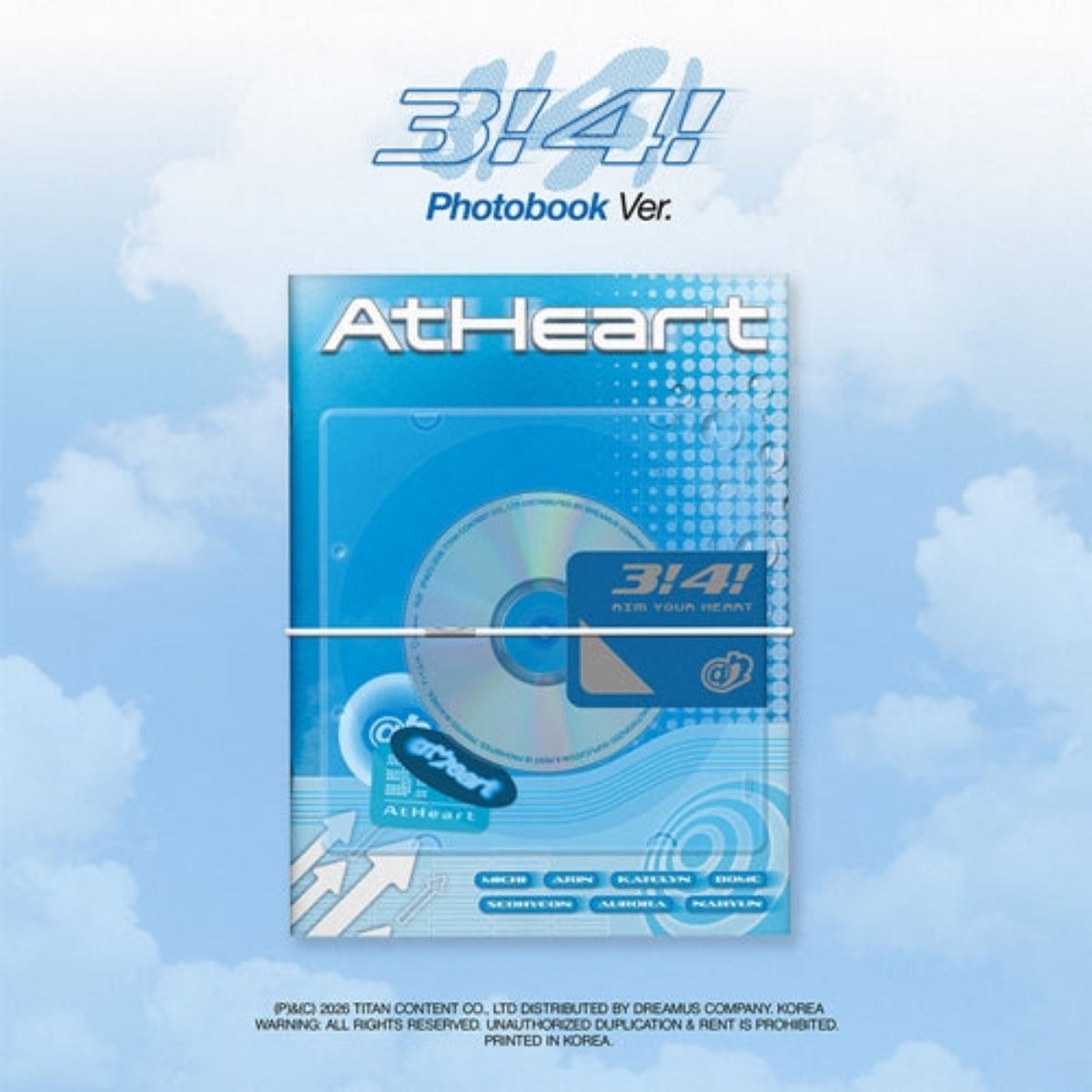 A photobook CD package for AtHeart's 3!4! album, shown against a light blue sky and clouds background. The package is blue with white text and a CD visible through a clear window.